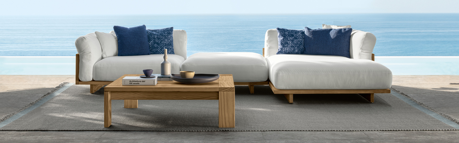 Beautiful garden furniture from Telenti with a stunning coastal backdrop