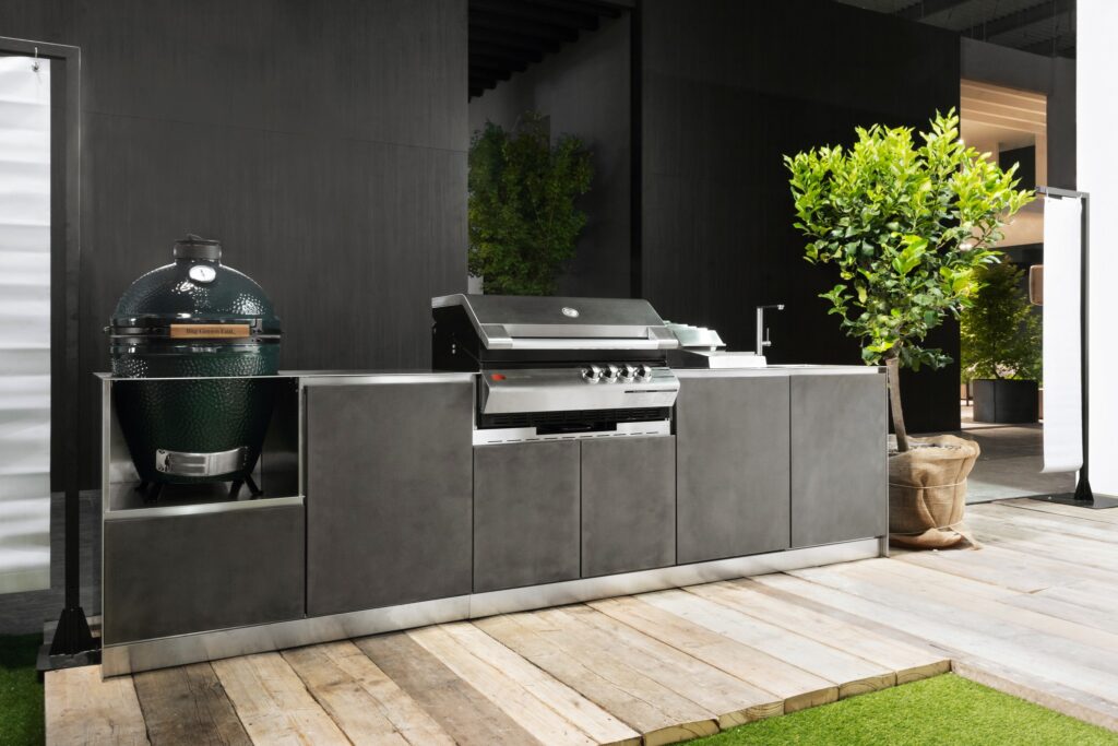 An enviable designer outdoor kitchen with gas barbeque and ceramic Kamado grill